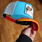 Gorra trucker azul y blanca dromedario Smokin' Somebody Stop Me Supercharged The Farm de Goorin Bros.