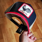 Gorra trucker azul marino y roja gallo Shleather Cock The Farm de Goorin Bros